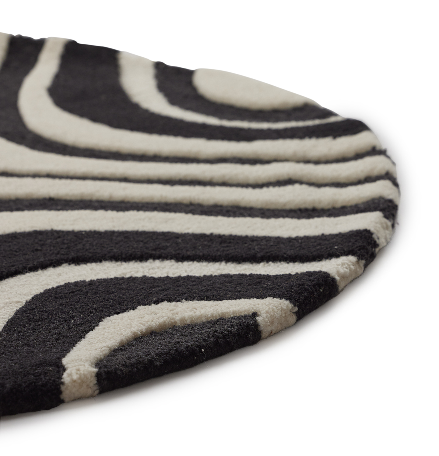 a 3 foot round black and white mini rug