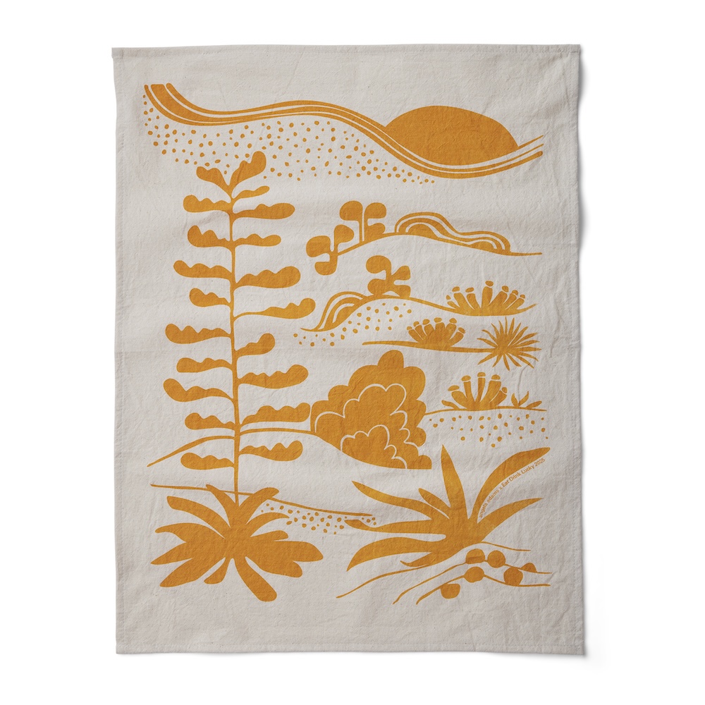 photo of a tea towel with the orange agave design on it