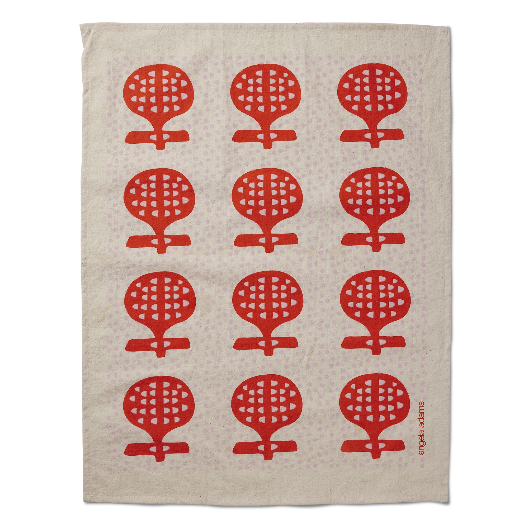 A light beige tea towel features a repeating pattern of twelve red, abstract, stylized flowers arranged in four rows of three. Each flower shape resembles a round, gridded head atop a short, thick stem with a horizontal bar. "angela adams" is written vertically in small red letters on the right edge of the towel.
