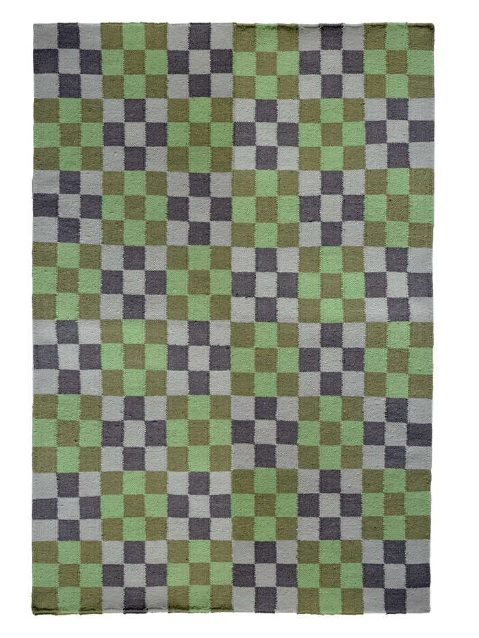 A rectangular rug features a checkerboard pattern. The squares are in shades of green and gray. There are light green, medium green, dark green, light gray, and dark gray squares, creating a varied, earthy, and cool-toned mosaic.