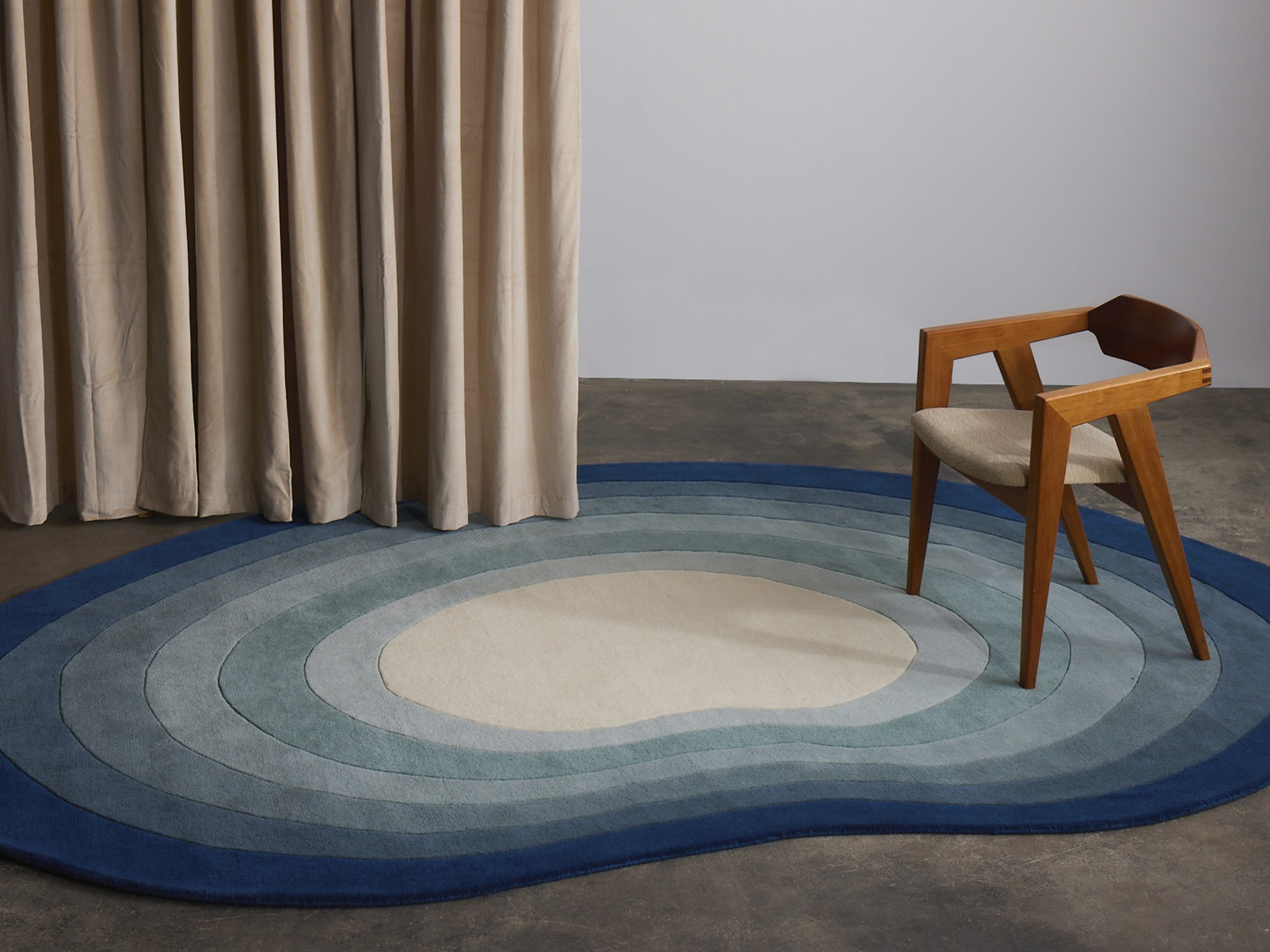 A pool shaped rug called Pool Dream