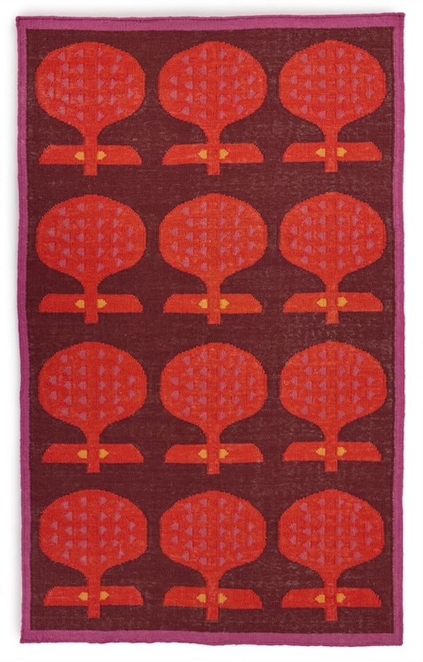 An abstract 5x8' light red and dark beet red repeating pattern on a red area rug named Happipod Berry.