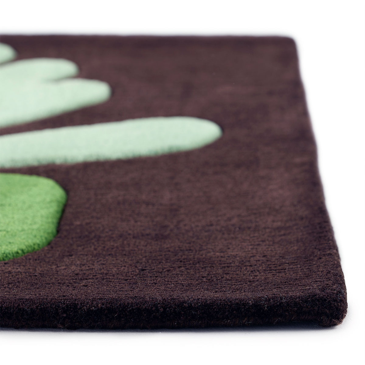 The edge of an abstract green, plant design on dark background.