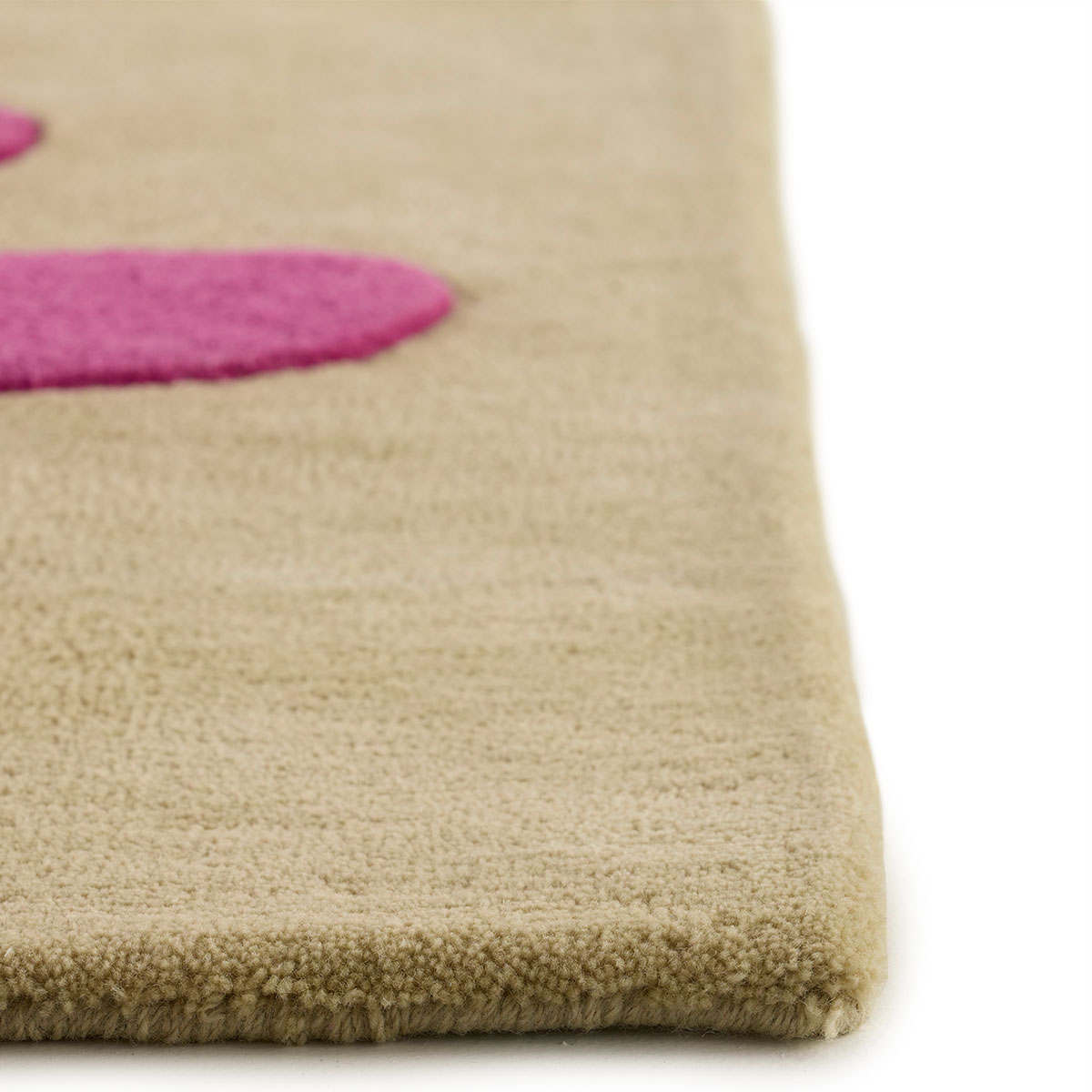 The corner detail of an abstract tan, pink, and brown rug named Seaflower Rugosa.