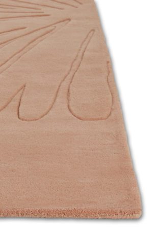 A corner of a modern area rug in pink called Daisies Petal