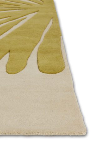A corner of a modern area rug in yellow called Daisies Sunny