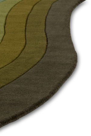 A close up of a green gradient area rug called Pool Woodland in the shape of a pool