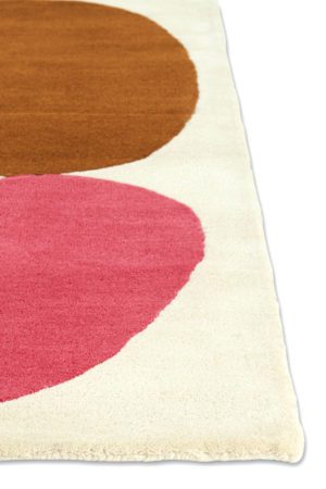 A corner of a modern rug called Three Stones Clay
