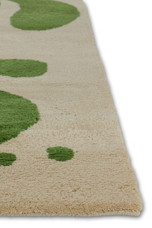A neutral and green area rug with abstract designs on it called Vine Mambo